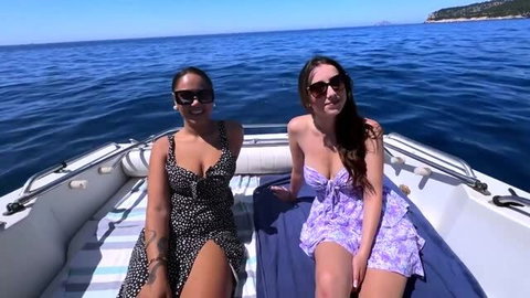 Elektra and Hellomoonli in bikinis on a yacht, Hellomoonli in polka dot dress