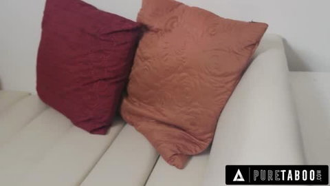 Avi Love on white couch with red and orange pillows - Pure Taboo thumbnail