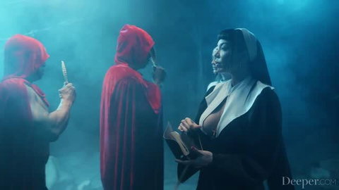 Nun Kenna James confronts hooded cult members in ritual scene