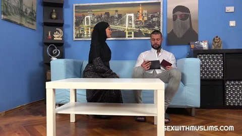 Muslim woman in niqab with Angelo Godshack on blue couch, Sex With Muslims