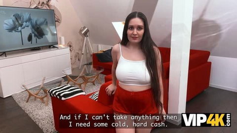 Brunette in white crop top and red skirt posing in modern living room