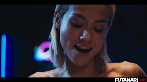 Horny blonde woman with wet lips and aroused expression in neon-lit scene