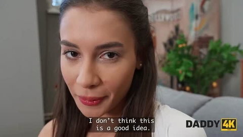 Brunette woman in white top looking at camera, Daddy4k hardcore scene