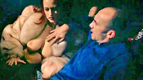 Rita Faltoyano exposes big tits in open fur coat to bald man