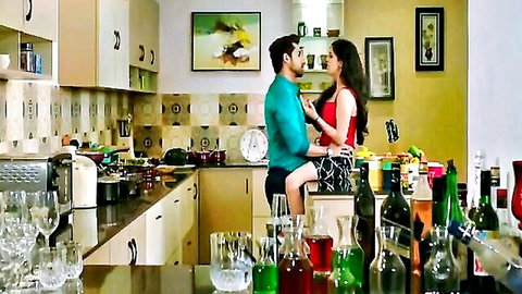 Indian couple in naughty neighbor roleplay, intimate embrace in kitchen