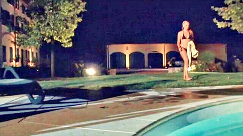 Tarra White in black bikini walking poolside at night, sexy solo tease