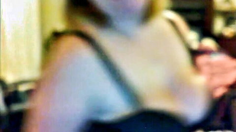 Samantha stripping in black lingerie, busty blonde tease