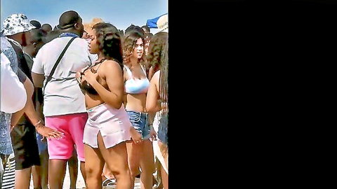 Spring Break 2020 South Padre beach party with bikini-clad women and crowds