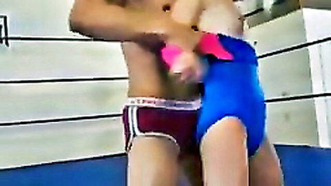 Muscular guy wrestling petite brunette teen in tight blue leotard in ring