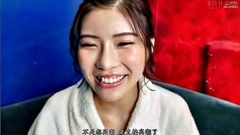 Smiling Japanese SOD brunette actress in fluffy white bathrobe teasing reveal