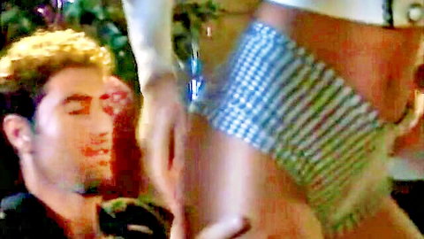 Curly haired man licks woman's bubble butt in checkered panties high heels vintage scene