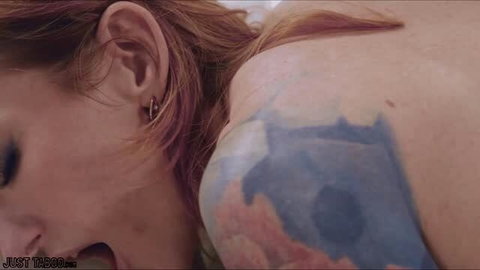 Redhead stepmom with colorful shoulder tattoo moaning in pleasure