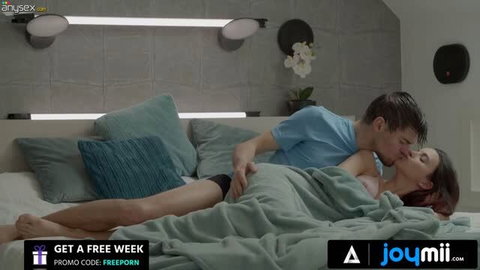 Brunette woman in bed with lover, intimate couple scene