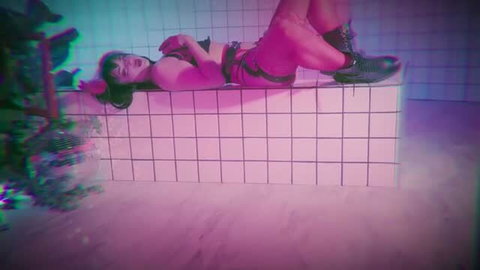 Pink-haired woman in lingerie lying on tiled ledge in dreamy aesthetic