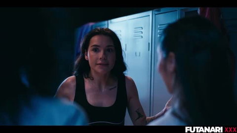 Futuristic locker room scene with tattooed brunette in black tank top