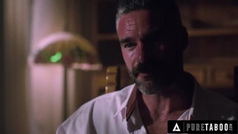 Creepy stepdad with graying hair in white shirt looking intensely