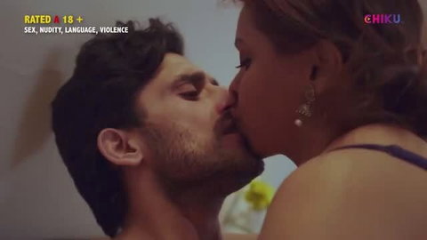 Passionate close-up kiss between Indian couple in erotic web series scene