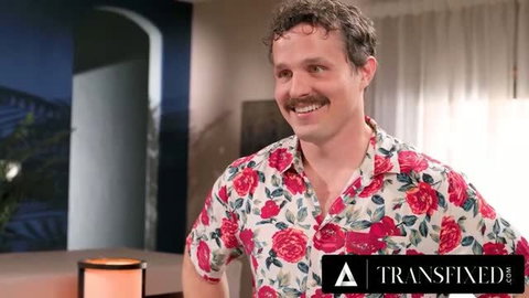 Smiling man with mustache in floral shirt from Transfixed