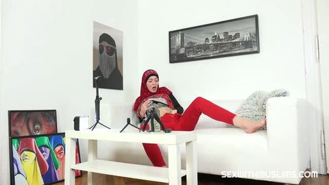 Little Bit in red hijab and leggings masturbating on couch