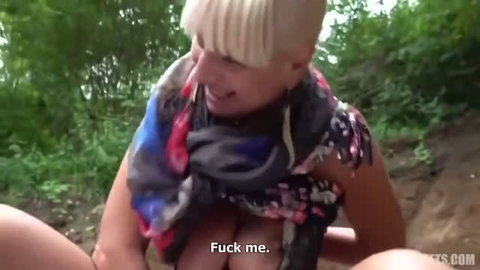Blonde GILF with short bob and scarf gives outdoor blowjob on street