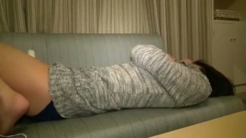Asian woman in sweater lying on couch, softcore adult thumbnail