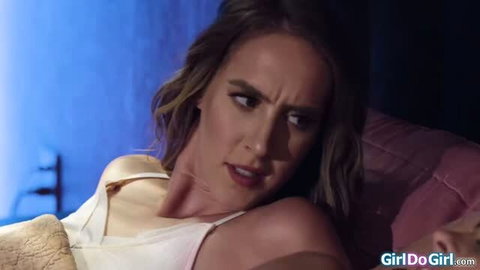 Blonde woman looking surprised while lying down, softcore lesbian scene