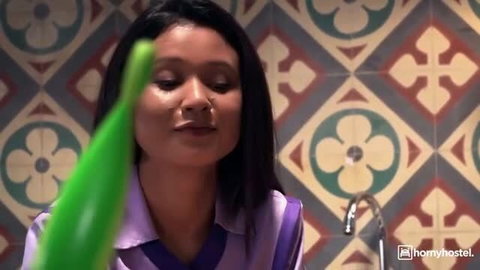 Jade Presley in maid uniform with green dildo, seductive expression