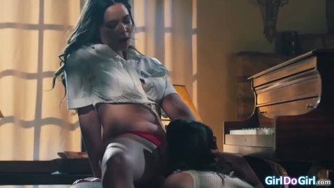 Two women in passionate lesbian sex, one sitting on the other's face