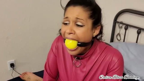 Calisa Bliss frogtied in pink leather straitjacket with yellow ball gag
