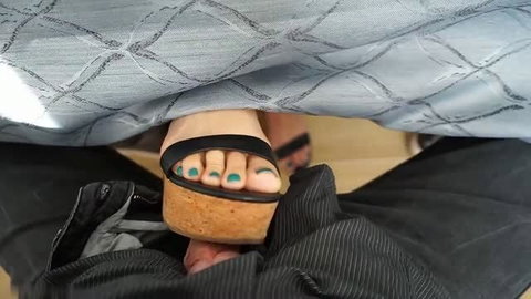 Footjob under table with teal toenails and platform wedge sandal