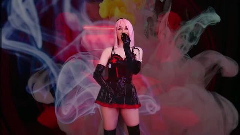 Pink haired domme in black latex nurse dress with red accents, holding gas mask