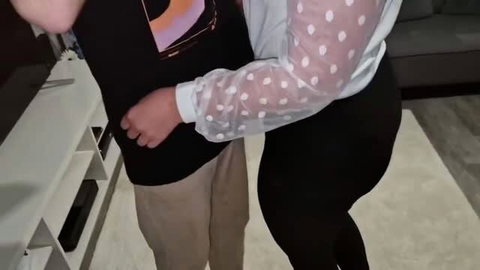 Curvy woman in sheer polka dot top rubbing man's crotch
