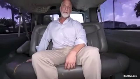 Rick Kelson in white shirt on Bait Bus backseat