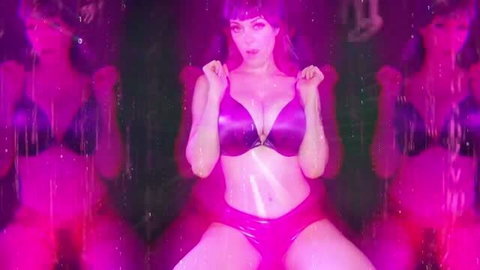 Miss Alika White in shiny purple latex bikini, goon cave fetish scene