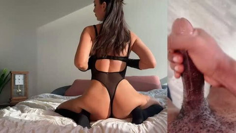 Woman in black lingerie and thigh-high socks posing on bed, close-up BBC handjob