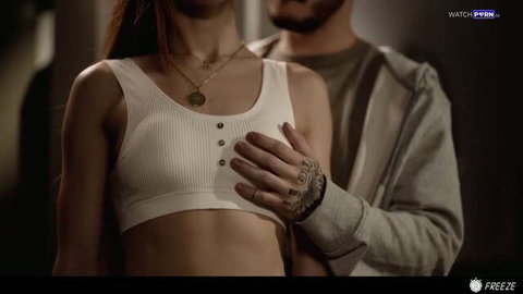 Little Dragon in white crop top, man's tattooed hand on her chest - Freeze studio