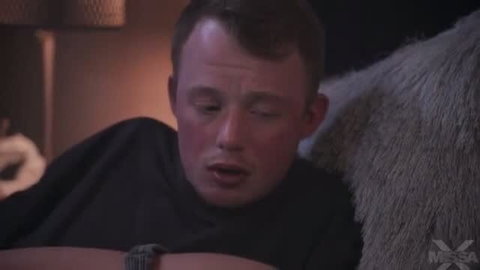 Close-up of man moaning during intimate scene