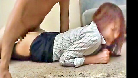 Asian woman in black panty stockings facesits another on floor