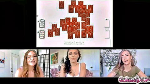 Three amateur women on webcam chat, smiling and playing cards online