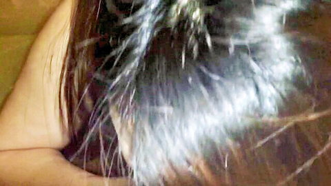 Closeup of sexy brunette's wet messy long hair and bare shoulder after intense sex