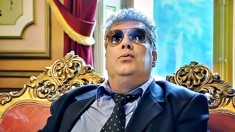 Priva in Perfect Sex (2006) - Mature man in suit and sunglasses smirking seductively