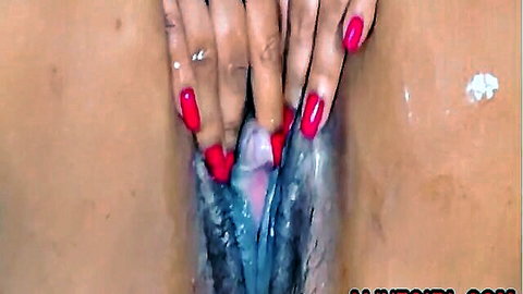 Wet and juicy pussy close-up, hands with red nails spreading labia, creamy cum visible