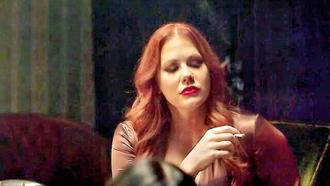 Maitland Ward redhead in seductive maroon dress smoking