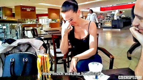 Emotional brunette babe crying over handbag price in public with smiling guy