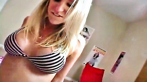 Blonde woman in striped bikini top, pregnant belly, seductive smile close-up