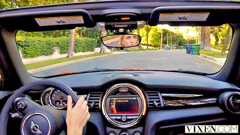 Mazzy Grace blonde smiling in rearview mirror while driving car POV