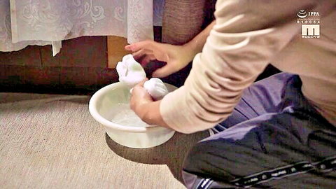 Sakura Miura kneeling in beige sweater, washing white socks in basin, JAV solo scene
