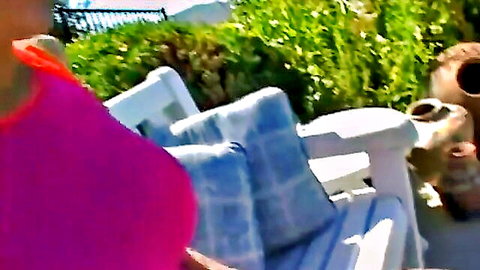Eve Laurence seductive outdoor tease in pink top, deep cleavage