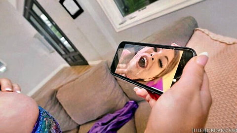 Savannah Bond holding phone mirror of open-mouth oral in DP scene