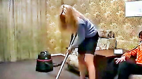 Blonde MILF bending over in short skirt vacuuming while boy watches